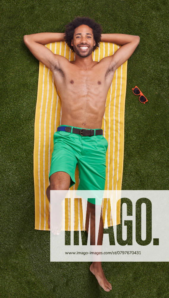 Taking some time off. A young african man relaxing on the grass, model released, , 48871236.jpg, african, man, grass, fashion, people, portrait, happy, male, smiling, smile, looking, summer, person, real, casual, handsome, ethnic, green, towel, colorful, carefree, relaxed, ethnicity, informal, happiness, color, positivity, colourful, vibrant, vivid, length, screen, clothes, background, bright, colours, colors, lying, down, coloured, colored, brightly RECORD DATE NOT STATED