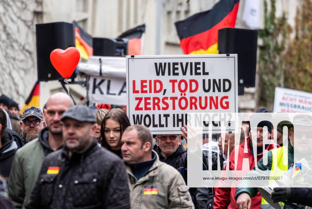 Commemoration of the victims and their relatives in Aschaffenburg, demonstration and march after knife attack against current government and political actions. Protest poster at right-wing demonstration in Aschaffenburg: How much more suffering, death and destruction do you want?