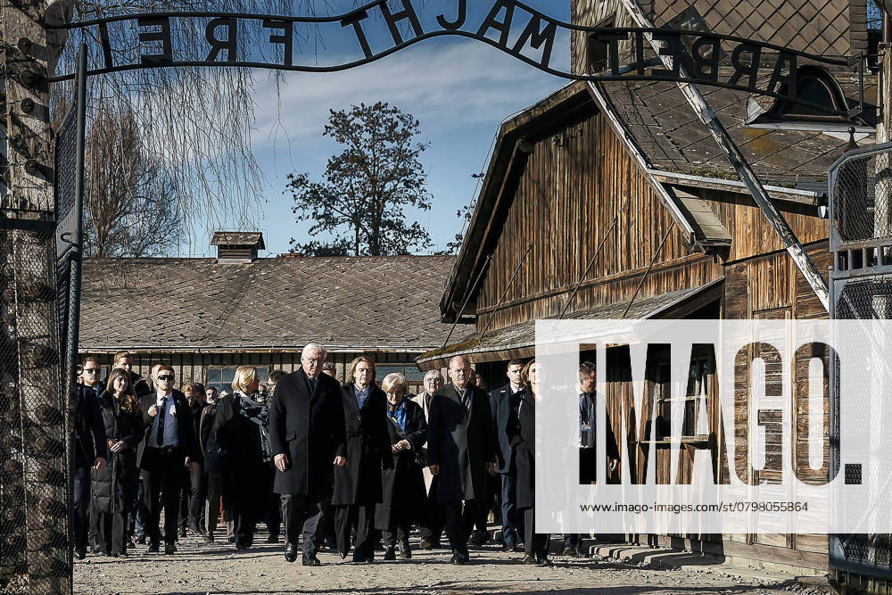 Auschwitz Birkenau concentration camp memorial commemorating 80 years since the liberation of the concentration camp A delegation including Federal Chancellor Olaf Scholz SPD and Federal President Frank Walter Steinmeier enters the former concentration camp through the gate with the slogan Arbeit macht frei (Work sets you free)