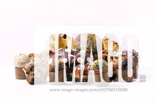 A variety of colorful and delicious panettone cakes with sprinkles and chocolate glaze on a white background. 28665541 RECORD DATE NOT STATED