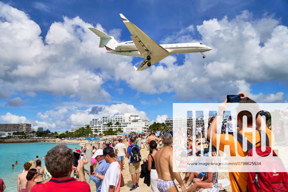 Sint Maarten, Caribbean - January 3, 2025: A Gulfstream G650 approaching Maho Beach in Sint Maarten.Tourists watch the spectacular event as the plane takes off for Princess Juliana International Airport