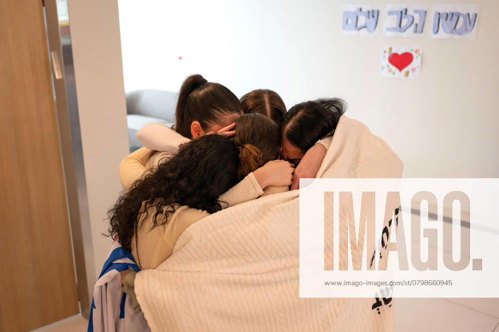 Female IDF soldier AGAM BERGER, 21 (olive green), unites her four field observer colleagues, KARINA ARIEV, DANIELLA GILBOA, NAAMA LEVY and LIRI ALBAG, released Saturday, at the Bellinson Hospital. Berger, Arbel Yehud, 29, and Gadi Mozes, 81, and five foreign Thai workers, were released today after 482 in Hamas captivity in Gaza, kidnapped on October 7th, 2023. Petach Tikva Israel - ZUMAi99_ 20250130_zip_i99_010