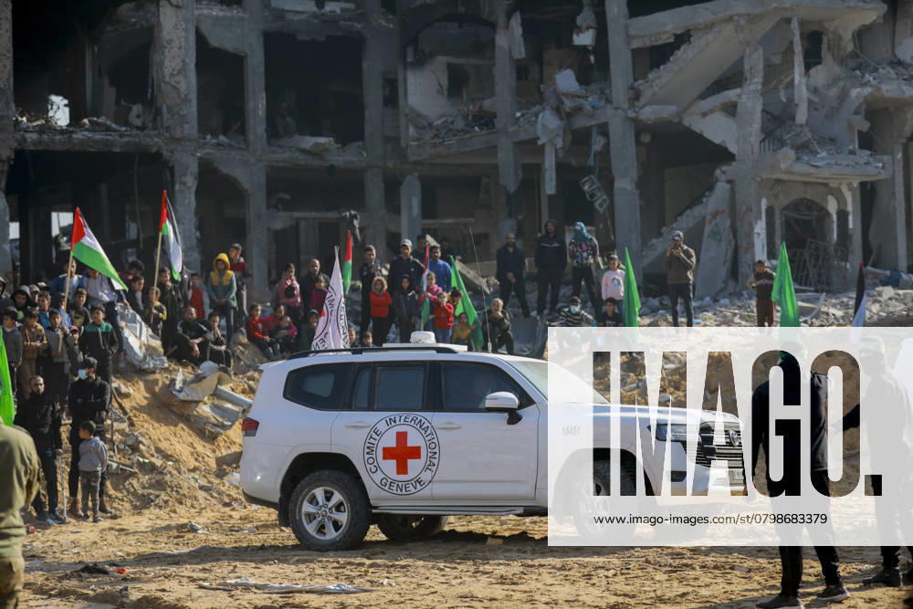 Freeing the captives A Red Cross convoy drives through the rubble of buildings as they arrive for the hand over of Israeli hostage Agam Berger in Jabalia on January 30, 2025, as part of their third hostage-prisoner exchange. Palestinian militant group Hamas on January 30 handed over Israeli woman hostage Berger, a soldier, as a third hostage-prisoner exchange got under way, an AFP journalist reported. Gaza Gaza Strip Palestinian Territories
