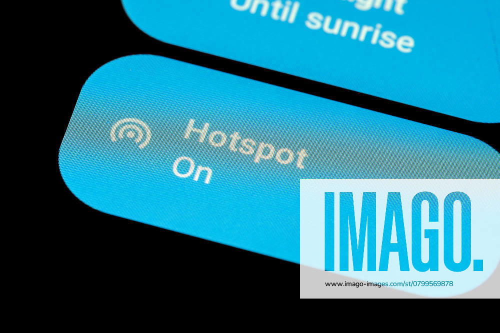 Activated control button of a smartphone hotspot to provide a WiFi connection for other devices , 49207494.jpg, hotspot, android, wifi, wlan, device, screen, enabled, enable, activate, active, others, smartphone, phone, mobile, mobile phone, monitor, share, sharing, mobile data, data, connection, access point, access, hot spot, close-up, nobody, no one, no people, internet, symbol, icon, idea, concept, options, option, settings, setting, control panel, on the go, black, dark, background, button, user interface, ui, wireless, on the move, lte, 5g RECORD DATE NOT STATED