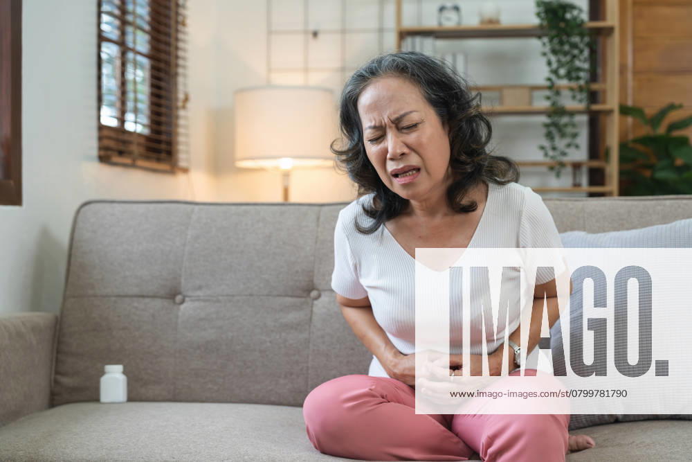 Elderly asian woman having painful from stomach ache at home,Senior female suffering with abdominal pain., model released, , 49315966.jpg, disease, ache, elderly, pain, senior, stomach, health, sick, old, belly, woman, problem, home, painful, person, man, aged, hand, female, ill, medicine, male, unhealthy, mature, abdominal, suffering, adult, retired, abdomen, caucasian, diarrhea, illness, retirement, care, cramp, people, asian, sitting, abdominal pain, unhappy, constipation, patient, unwell, bowel, discomfort, dyspepsia, expression, health care, holding, concept RECORD DATE NOT STATED