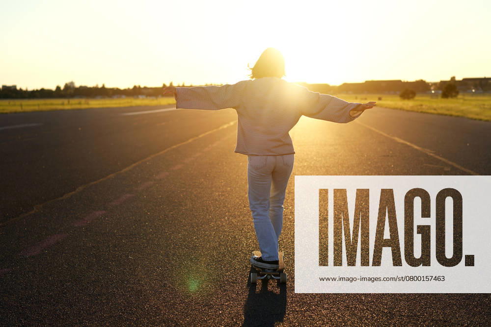 Carefree teen skater girl riding her skateboard with hands spread sideways, skating alone towards the sun., model released, , 49591226.jpg, girl, woman, skater, skateboarder, skateboarding, skateboard, fashion, person, sport, summer, spring, board, young, cruiser, lifestyle, park, female, skate, active, fun, leisure, day, street, activity, cool, longboard, people, start, hipster, teen, race, stylish, outdoors, sitting, teenager, youth, biker, modern, action, ride, trendy, relax, urban, asia, asian, korean, japanese, sun, outdoor, road RECORD DATE NOT STATED