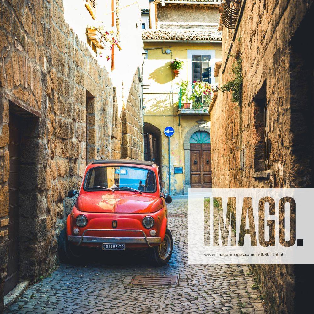 Age Red Fiat 500 park in a narrow Sac Oldtimer Orvieto Umbria Italy Europe