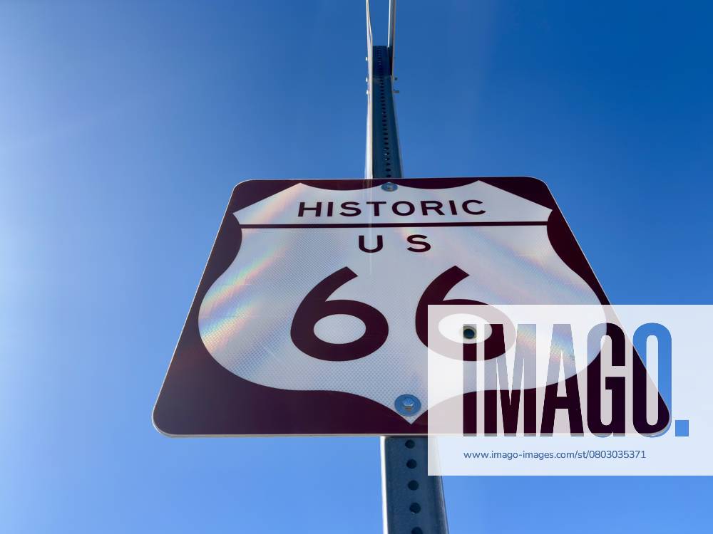 Historic Route 66 road sign against a clear blue sky in Arizona. Ash Fork, Arizona, United States R_RMYC250216-1649775-01