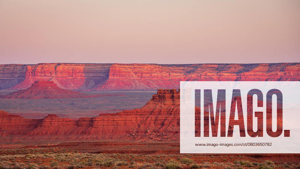 Pink and red sandstone rock formations at sunrise Mexican Hat, Utah, United States CR_KEDA250217-1650365-01