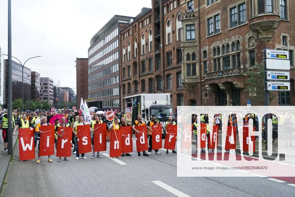 Hamburg Demonstration the Dockworkers with Verd I Flags Banner transparent with the Inscription We are the Port Hundreds demand more Wages and better Working conditions the Demonstration led to mas