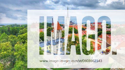 Scenic view of Tallinns Old Town with medieval towers and lush greenery under a cloudy sky. 26441611 RECORD DATE NOT STATED