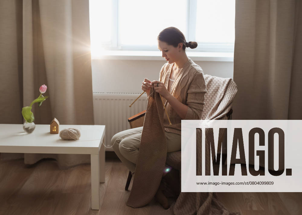 Young woman knitting in a cozy room at home, model released, , 50698012.jpg, hobby, knit, soft, textile, knitted, scarf, accessories, needlework, hands, lifestyle, woman, creative, detail, leisure, thread, needle, woolen, handmade, close-up, craft, yarn, wool, beige, knitwear, background, texture, sweater, knitting needles, activity, girl, domestic, relax, sitting, leisure activity, female hands, work, knitting, warm, clothing, handwork, occupation, caucasian, comfortable, enjoyment, bed, cozy, fabric, young, brown, female RECORD DATE NOT STATED