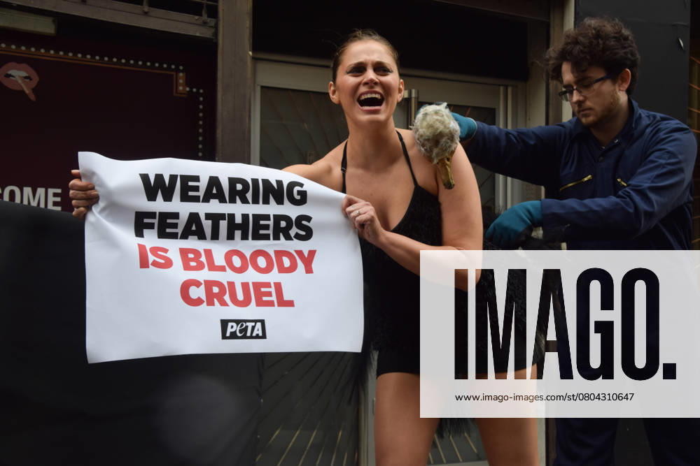 A PETA activist dressed as an ostrich has her feathers violently plucked outside the London Fashion Week NEWGEN show space on The Strand. The action is part of the ongoing PETA campaign against the use of feathers in fashion. London UK - ZUMAv130 20250221_zip_v130_002