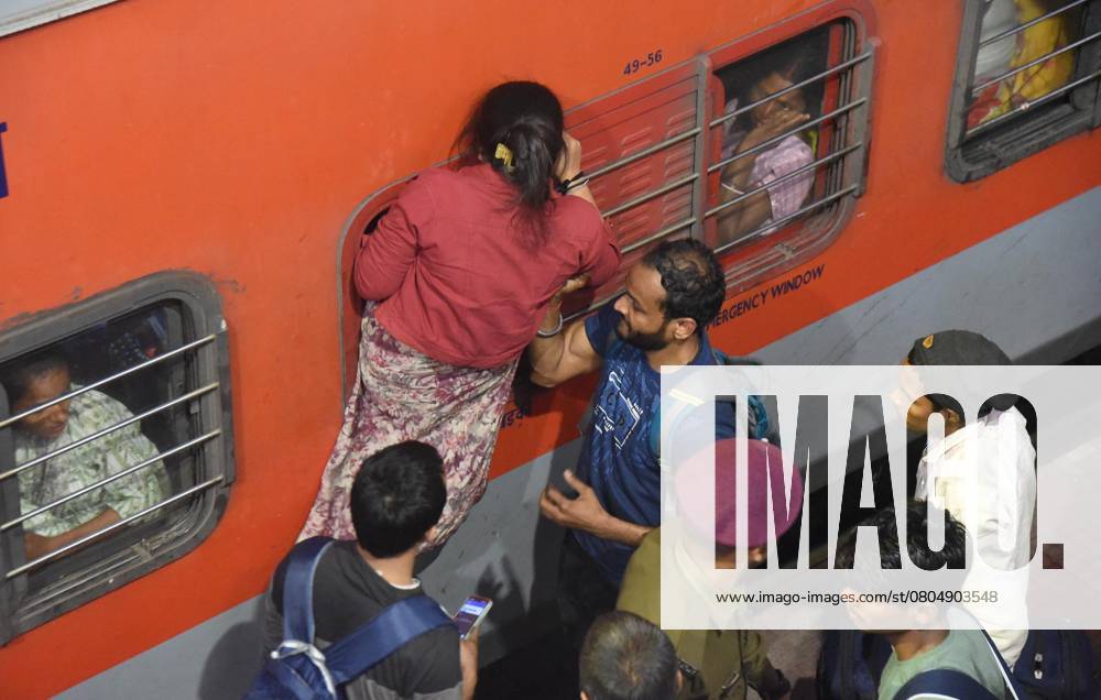 Passengers jostle to board an overcrowded train amid rush owing to the ongoing Prayagraj s Mahakumbh Mela, at Patna railway station , on February 23, 2025 in Patna, India. (Photo by Santosh Kumar Hindustan Times ) Heavy Crowds Of Passengers To Board Train At Railway Stations
