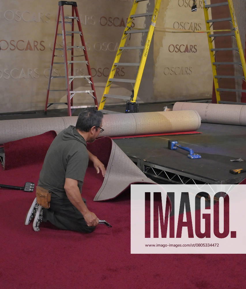 Crew members roll out the red carpet in preparation for the 97th Academy Awards in the Hollywood section of Los Angeles, California on Wednesday, February 26, 2025. Oscar winners will be announced during an ABC live telecast on March 2. LAP2025022605 JIMxRUYMEN