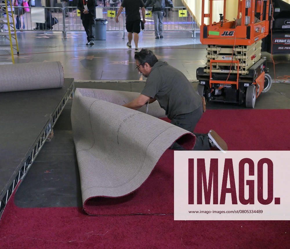 Crew members roll out the red carpet in preparation for the 97th Academy Awards in the Hollywood section of Los Angeles, California on Wednesday, February 26, 2025. Oscar winners will be announced during an ABC live telecast on March 2. LAP2025022603 JIMxRUYMEN