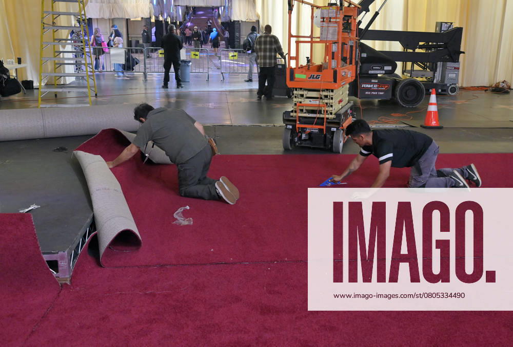 Crew members roll out the red carpet in preparation for the 97th Academy Awards in the Hollywood section of Los Angeles, California on Wednesday, February 26, 2025. Oscar winners will be announced during an ABC live telecast on March 2. LAP2025022604 JIMxRUYMEN