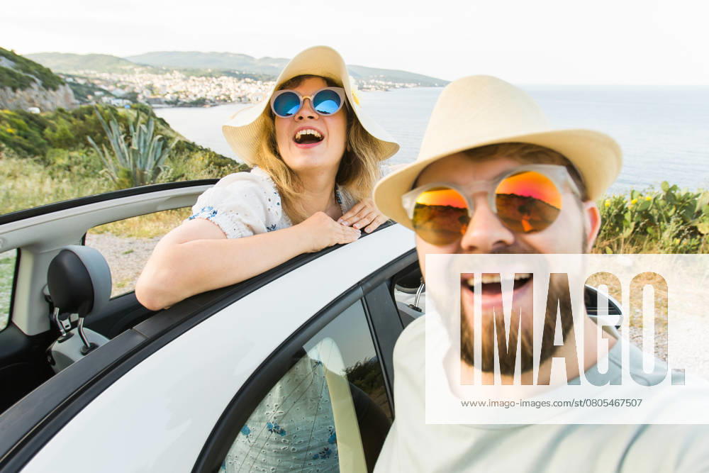 Romantic couple making selfie on smartphone camera in rental cabrio car on ocean or sea beach, enjoying summer vacation together and taking picture cellular resting near sea on weekends, model released, , 51335050.jpg, selfie, car, couple, vacation, cabrio, honeymoon, beach, summer, smartphone, vintage, camera, photo, weekends, rental, cellular, picture, together, standing, taking, journey, cellphone, adventure, convertible, young, technology, travel, phone, fun, road, mobile, male, travelers, friends, cabriolet, portrait, transportation, romantic, man, girlfriend, lifestyle, vacations, relationship, photography, communication, woman, tourism, holidays, tropical, trip, happy RECORD DATE NOT STATED