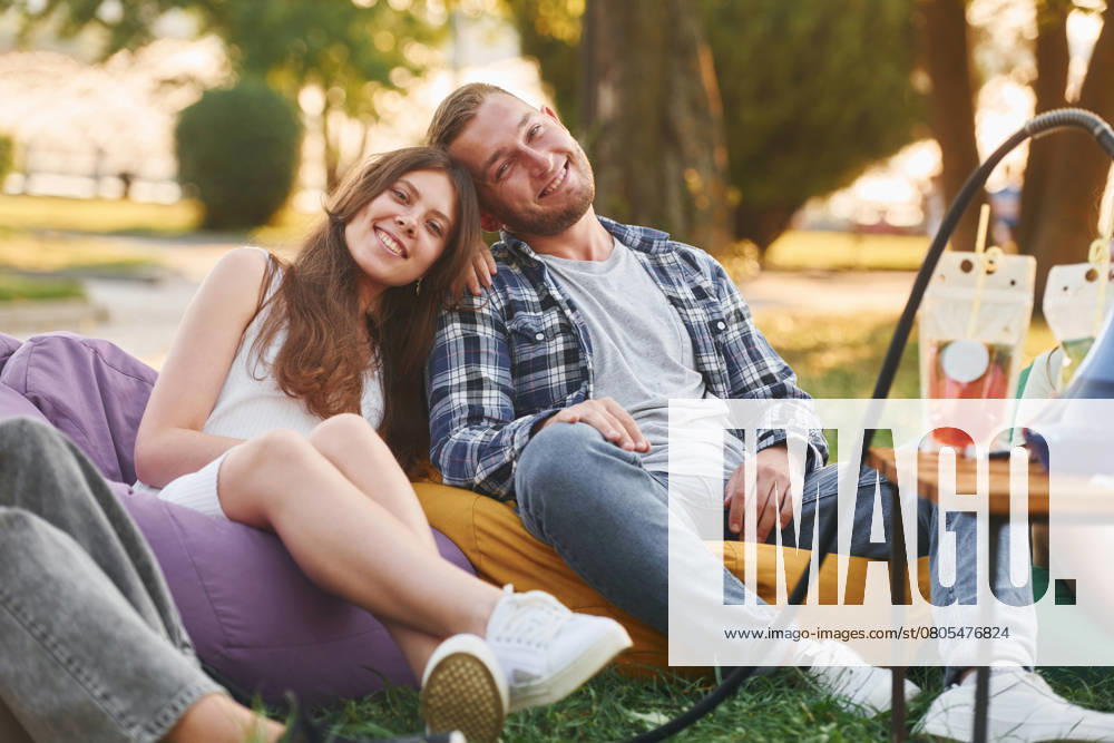 Happy couple. Group of young people have a party in the park at summer daytime., model released, , 51342462.jpg, group, people, hookah, sitting, relaxing, resting, smoking, culture, party, drink, cocktails, alcohol, beverage, armchair, bags, fun, together, outdoors, outside, summer, park, green, grass, caucasian, white, european, ethnicity, casual, clothes, wear, joy, cheerful, wellness, wellbeing, nice, positive, emotions, friends, weekend, leisure, free, time, sunlight, sunshine, beautiful, conversation, talking, communicating, socializing, young RECORD DATE NOT STATED