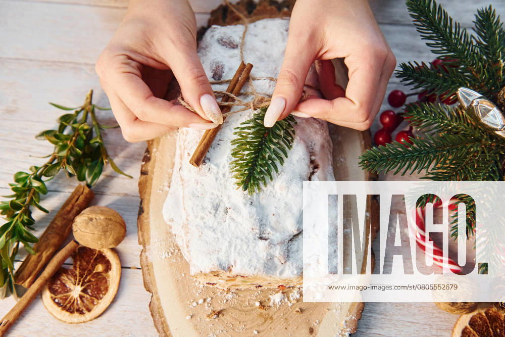 Stollen with holiday decorations. Christmas background., model released, , 51403462.jpg, background, new, year, stollen, woman, hands, holidays, x-mas, merry, christmas, decoration, objects, texture, eve, table, wooden, material, clean, clear, surface, anticipation, shape, mood, close, up, view, focused, detailed, joy, sweets, cookies, food, delicious, free, time, weekend, leisure, beautiful, artificial, lighting, quality, winter, season, colorful, bright, ideas, design, style, order, placing RECORD DATE NOT STATED