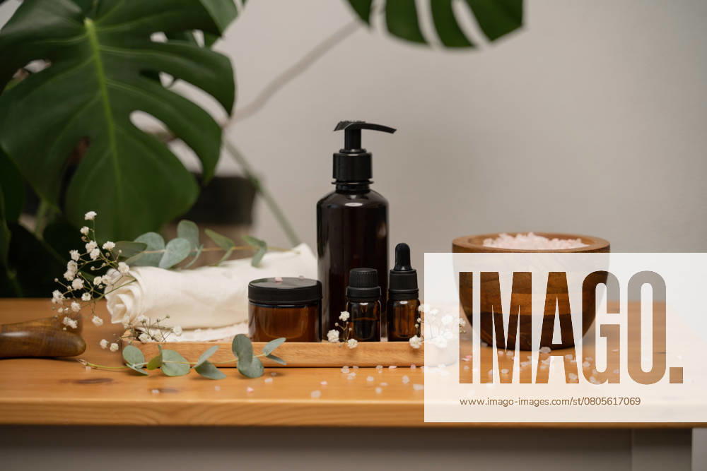 PR_ID26632_10596_Room.jpg, MR_ID26632_19749_DariaGolubeva.jpg, MR_ID26632_19750_JuliaGolubeva.jpg Organic skincare products in eco-friendly packaging with a wooden bowl of pink salt, eucalyptus leaves, and delicate flowers. Ideal for wellness, self-care, and natural living concepts., Property released Model Released LiliyaSolopova_ID26632_768700_038