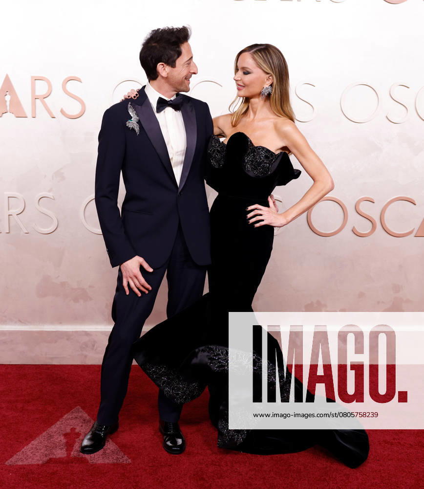 (L-R) Adrien Brody and Georgina Chapman arrive on the red carpet for the 97th Academy Awards in the Hollywood section of Los Angeles on Sunday, March 2, 2025. LAP20250302828 JOHNxANGELILLO