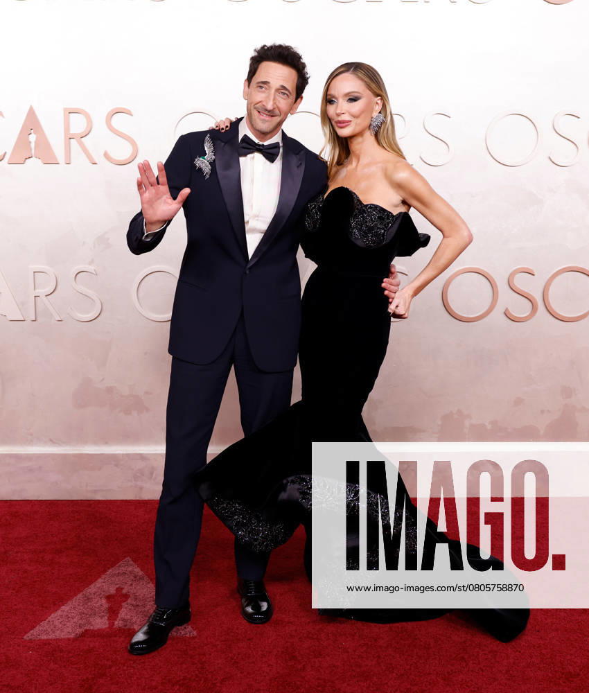 Adrien Brody and Georgina Chapman arrive on the red carpet for the 97th Academy Awards in the Hollywood section of Los Angeles on Sunday, March 2, 2025. LAP20250302901 JOHNxANGELILLO