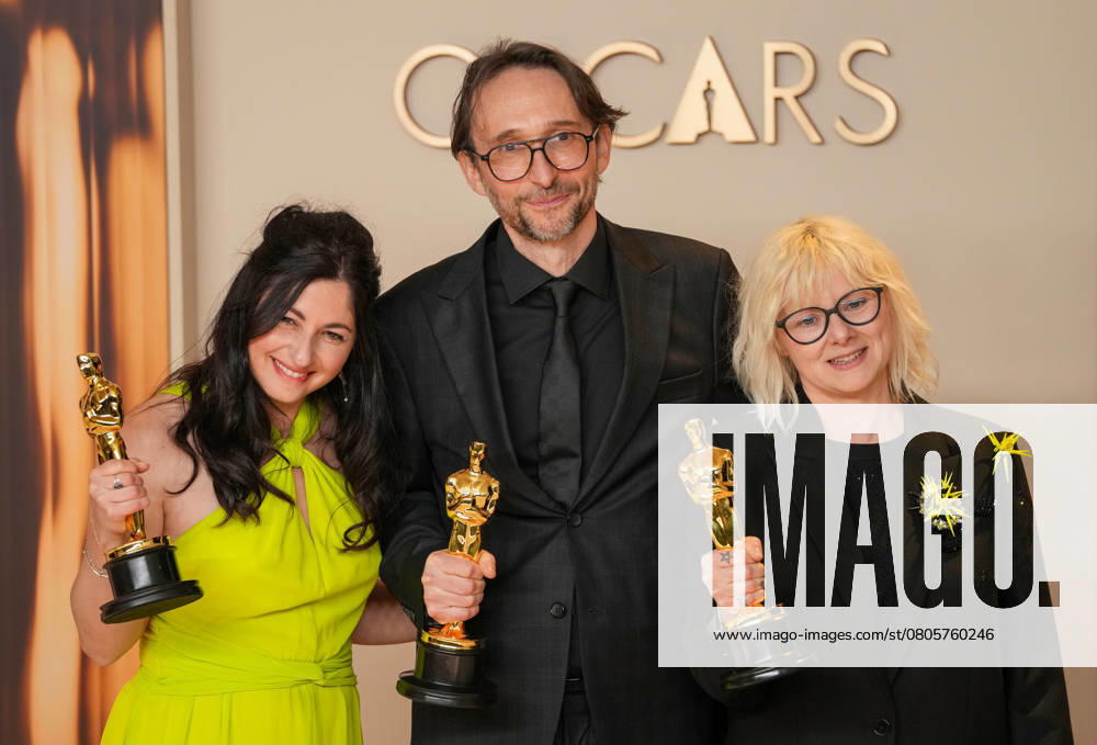 Marilyne Scarselli, Pierre-Olivier Persin, and Stéphanie Guillon (L-R) celebrate backstage after winning the Oscar for makeup and hairstyling for The Substance during the 97th Academy Awards in the Hollywood section of Los Angeles on Sunday, March 2, 2025. LAP20250302119 PATxBENIC