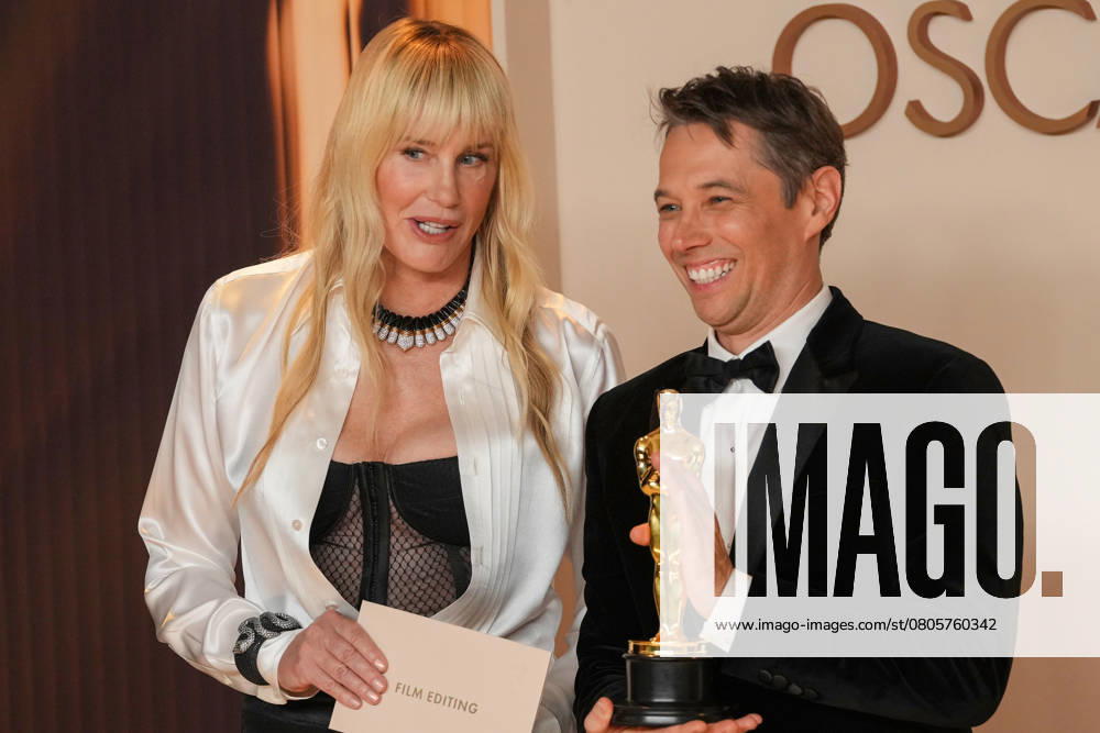 Sean Baker (R) celebrates backstage with Academy Awards presenter Daryl Hannah after winning the Oscar for film editing for Anora during the 97th Academy Awards in the Hollywood section of Los Angeles on Sunday, March 2, 2025. LAP20250302122 PATxBENIC