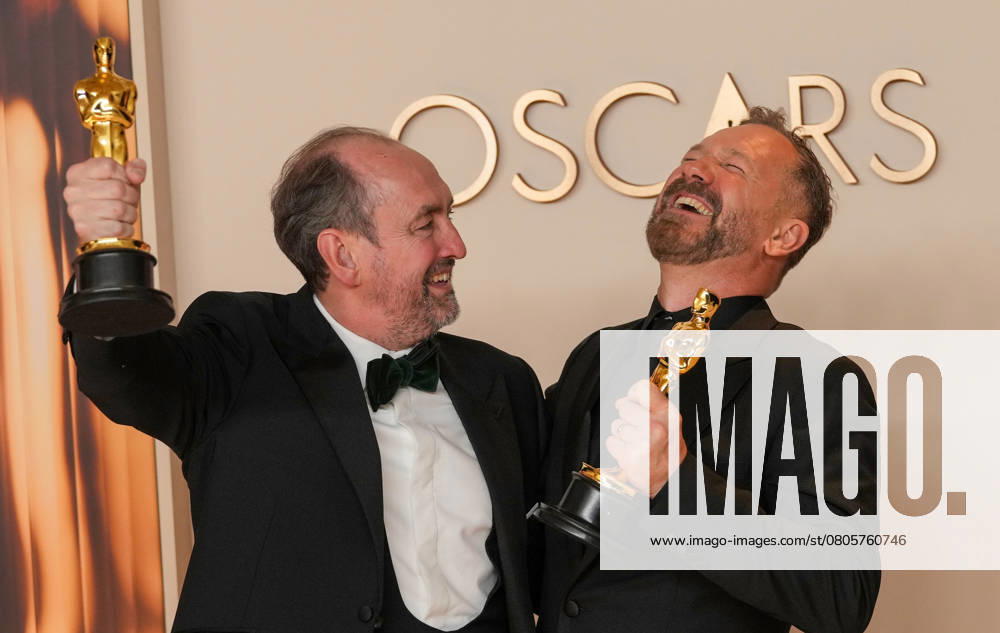 Nathan Crowley and Lee Sandales of Wicked celebrate backstage after winning the Oscar for best production design during the 97th Academy Awards in the Hollywood section of Los Angeles on Sunday, March 2, 2025. LAP20250302125 PATxBENIC