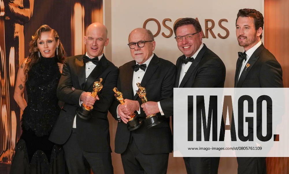 Academy Award presenter Miley Cyrus joins Gareth John, Richard King, Ron Bartlett, and Doug Hemphill (L-R) of Dune: Part Two celebrate backstage after winning the Oscar for best sound during the 97th Academy Awards in the Hollywood section of Los Angeles on Sunday, March 2, 2025. LAP20250302134 PATxBENIC