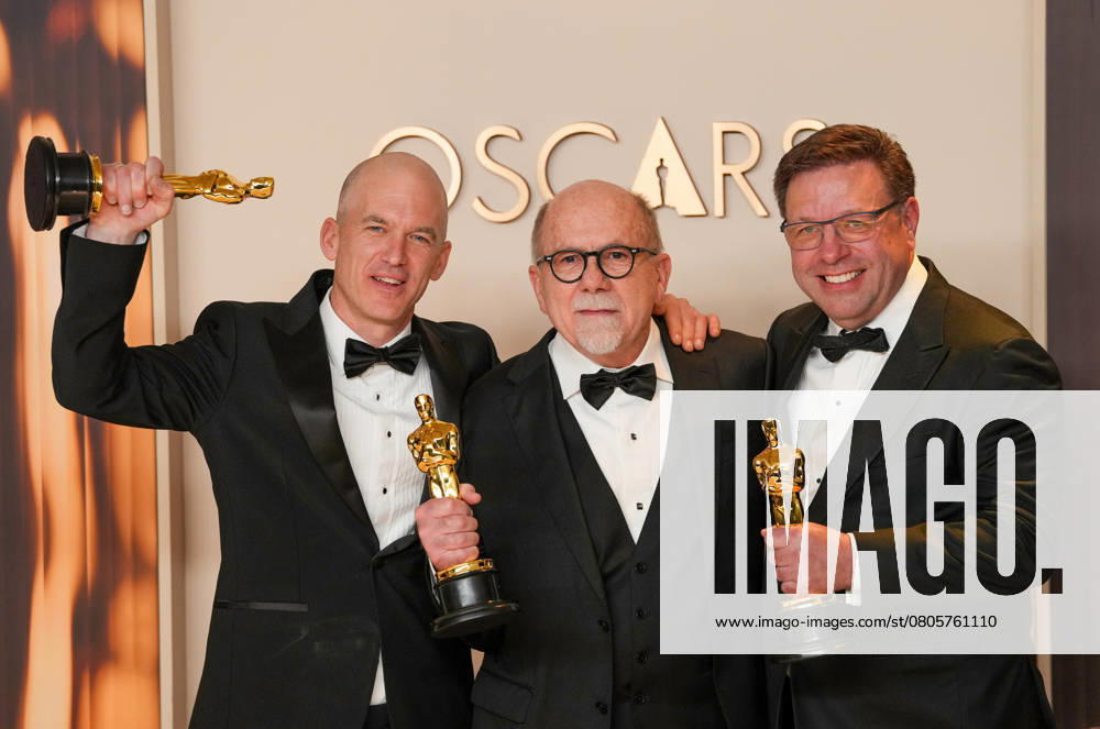 Gareth John, Richard King, and Ron Bartlett of Dune: Part Two celebrate backstage after winning the Oscar for best sound during the 97th Academy Awards in the Hollywood section of Los Angeles on Sunday, March 2, 2025. LAP20250302135 PATxBENIC