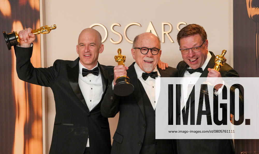 Gareth John, Richard King, and Ron Bartlett of Dune: Part Two celebrate backstage after winning the Oscar for best sound during the 97th Academy Awards in the Hollywood section of Los Angeles on Sunday, March 2, 2025. LAP20250302136 PATxBENIC