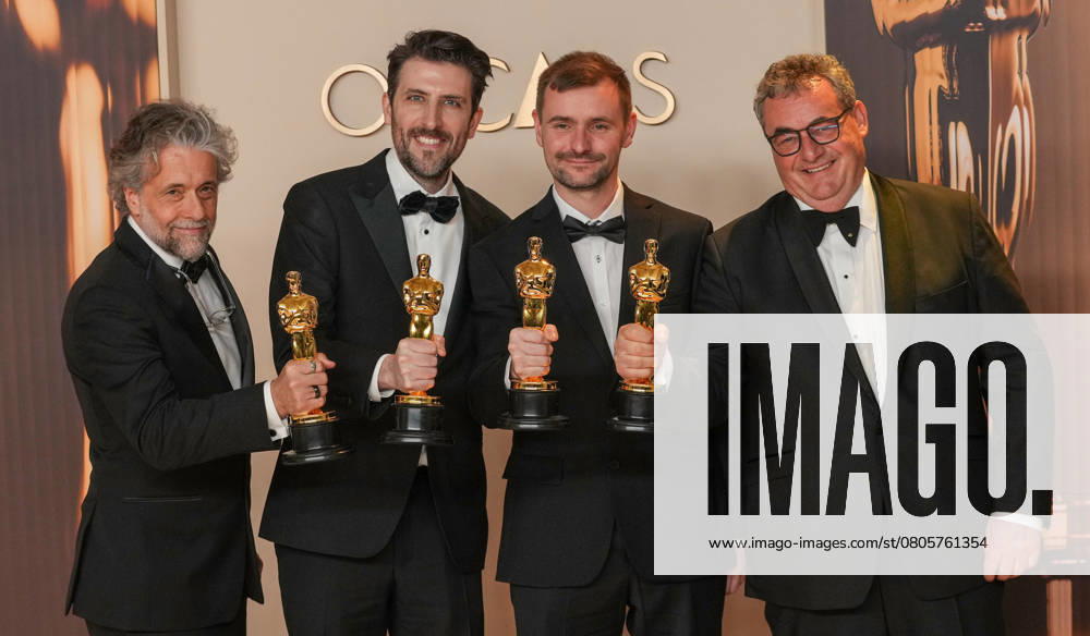 Paul Lambert, Stephen James, Rhys Salcombe, and Gerd Nefzer of Dune: Part Two celebrate backstage after winning the Oscar for best visual effects during the 97th Academy Awards in the Hollywood section of Los Angeles on Sunday, March 2, 2025. LAP20250302138 PATxBENIC