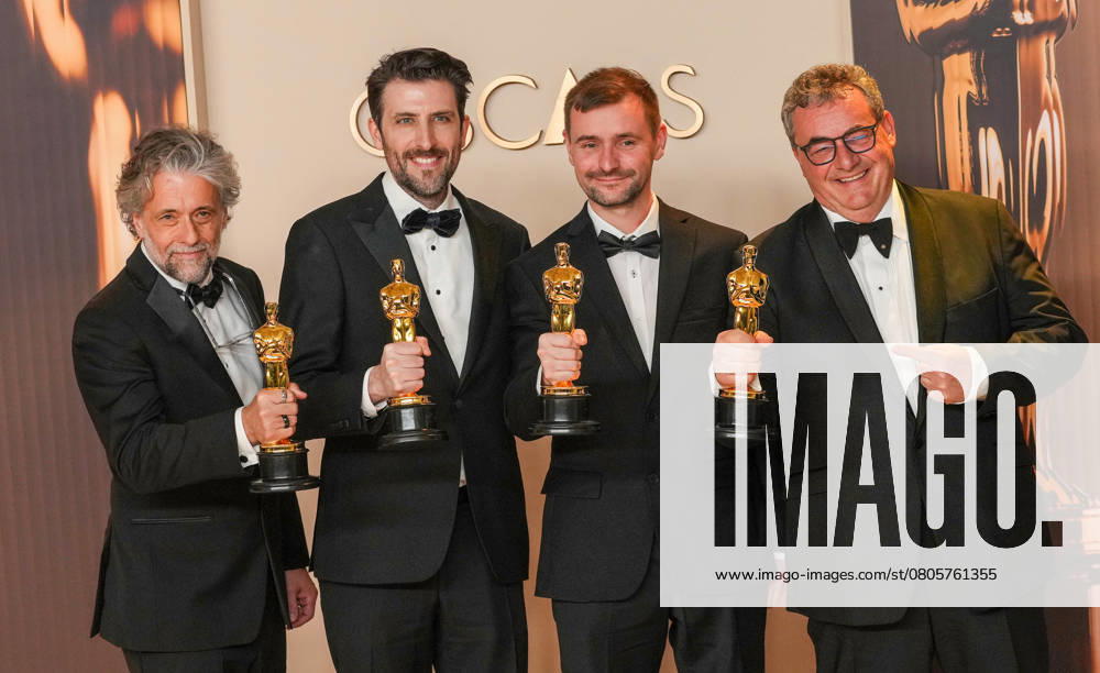 Paul Lambert, Stephen James, Rhys Salcombe, and Gerd Nefzer of Dune: Part Two celebrate backstage after winning the Oscar for best visual effects during the 97th Academy Awards in the Hollywood section of Los Angeles on Sunday, March 2, 2025. LAP20250302139 PATxBENIC