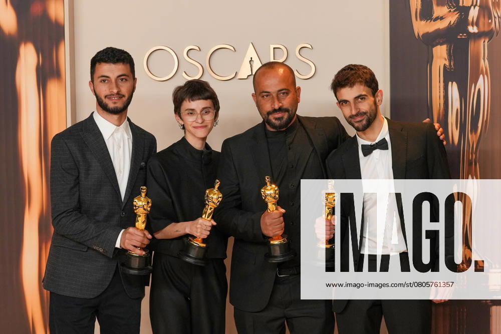 Basel Aero, Rachel Szar, Hamdan Ball, and Yuval Abraham of No Other Land celebrate backstage after winning the Oscar for best documentary feature film during the 97th Academy Awards in the Hollywood section of Los Angeles on Sunday, March 2, 2025. LAP20250302140 PATxBENIC
