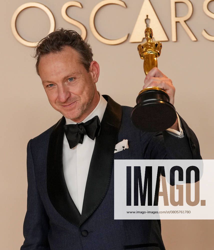 Lol Crawley of The Brutalist celebrates backstage after winning the Oscar for cinematography during the 97th Academy Awards in the Hollywood section of Los Angeles on Sunday, March 2, 2025. LAP20250302147 PATxBENIC