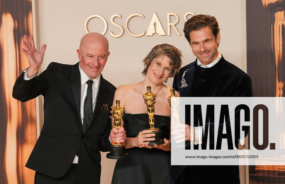 Clément Ducal, Camille, and Jacques Audiard of Emilia Pérez celebrate backstage after winning the Oscar for the original song titled El Mal during the 97th Academy Awards in the Hollywood section of Los Angeles on Sunday, March 2, 2025. LAP20250302153 PATxBENIC