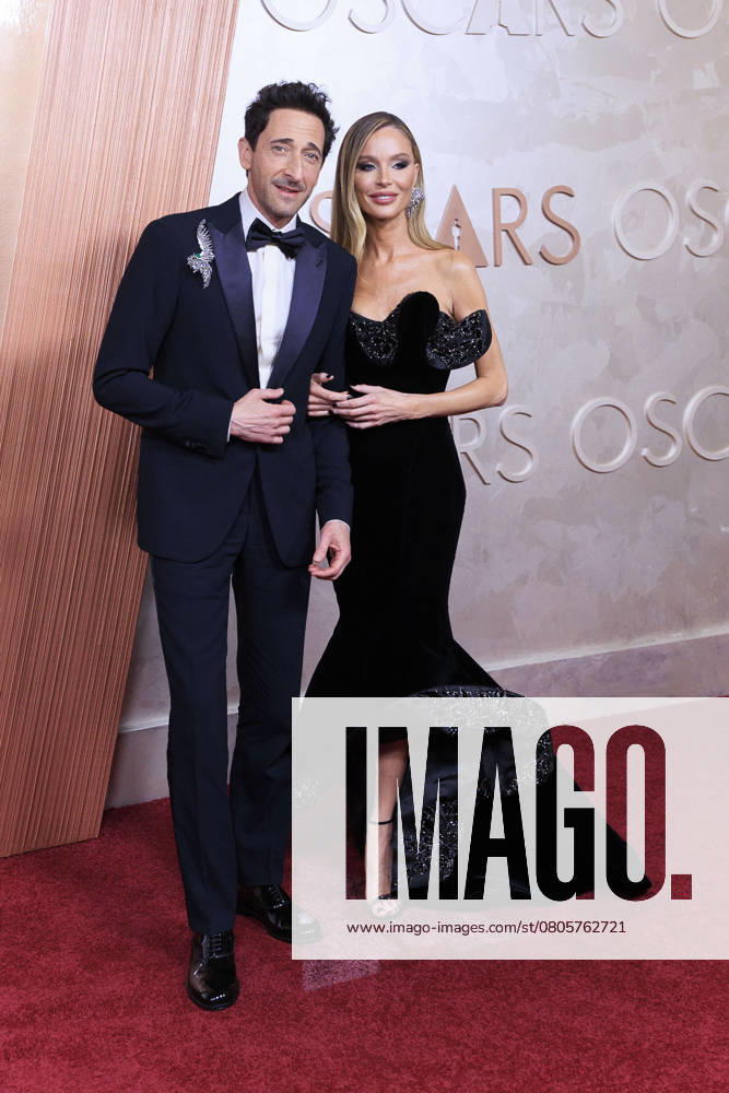 Adrien Brody and Georgina Chapman on the red carpet of the 97th Annual Academy Awards on Sunday March 2, 2025 at the Dolby Theater in Hollywood, California. BURT HARRIS BNS PI Hollywood USA - ZUMAp124 20250302_zaa_p124_321