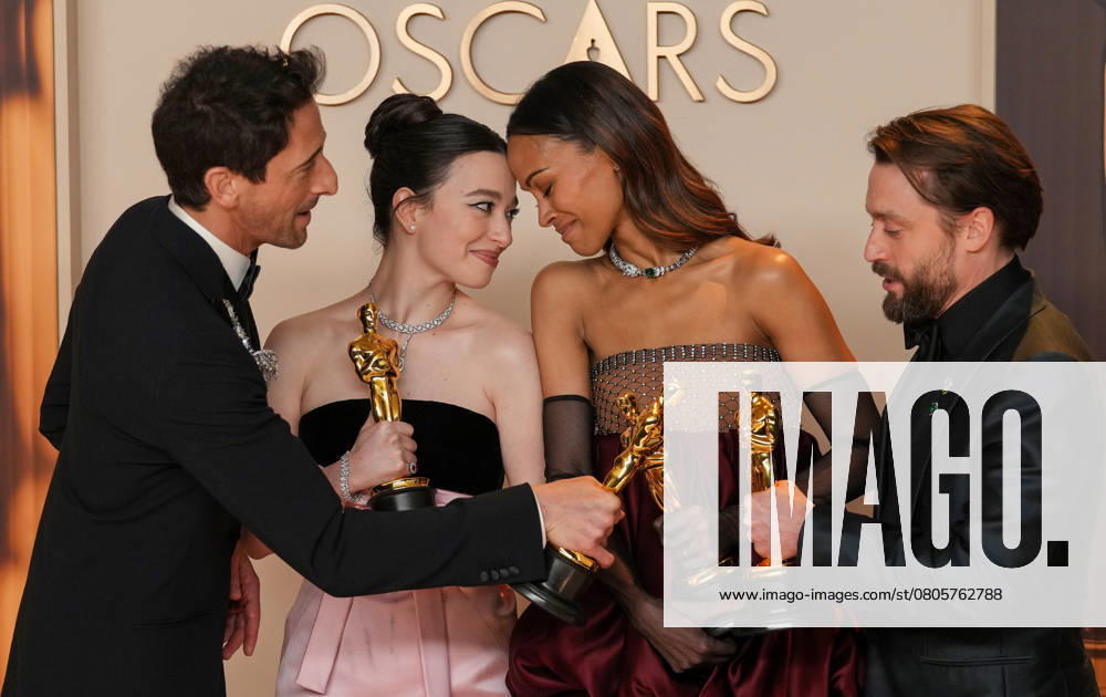 Best performance by an actor in a leading role Oscar winner Adrien Brody of The Brutalist celebrates backstage with best performance by an actress in a leading role winner Mikey Madison of Anora and best actress in a supporting role Oscar winner Zoe Saldana of Emilia Pérez with Kieran Culkin, Oscar winner for best actor in a supporting role (L-R) during the 97th Academy Awards in the Hollywood section of Los Angeles on Sunday, March 2, 2025. LAP20250302161 PATxBENIC
