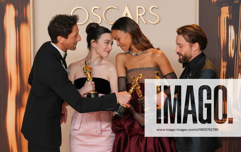 Best performance by an actor in a leading role Oscar winner Adrien Brody of The Brutalist celebrates backstage with best performance by an actress in a leading role winner Mikey Madison of Anora and best actress in a supporting role Oscar winner Zoe Saldana of Emilia Pérez with Kieran Culkin, Oscar winner for best actor in a supporting role (L-R) during the 97th Academy Awards in the Hollywood section of Los Angeles on Sunday, March 2, 2025. LAP20250302162 PATxBENIC
