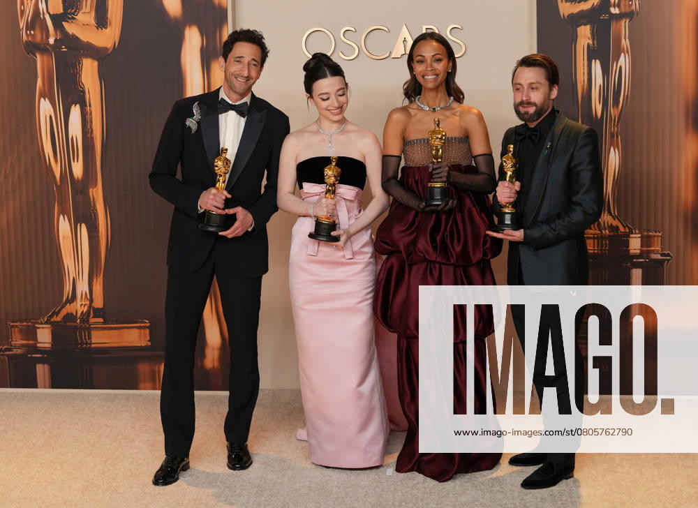 Best performance by an actor in a leading role Oscar winner Adrien Brody of The Brutalist celebrates backstage with best performance by an actress in a leading role winner Mikey Madison of Anora and best actress in a supporting role Oscar winner Zoe Saldana of Emilia Pérez with Kieran Culkin, Oscar winner for best actor in a supporting role (L-R) during the 97th Academy Awards in the Hollywood section of Los Angeles on Sunday, March 2, 2025. LAP20250302163 PATxBENIC
