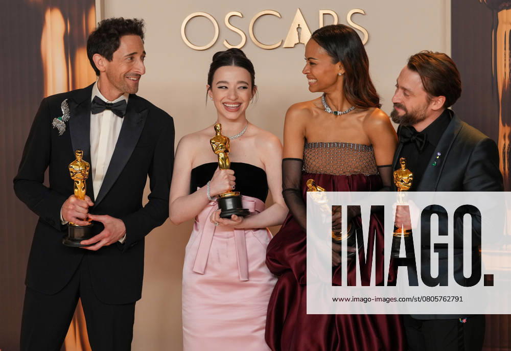 Best performance by an actor in a leading role Oscar winner Adrien Brody of The Brutalist celebrates backstage with best performance by an actress in a leading role winner Mikey Madison of Anora and best actress in a supporting role Oscar winner Zoe Saldana of Emilia Pérez with Kieran Culkin, Oscar winner for best actor in a supporting role (L-R) during the 97th Academy Awards in the Hollywood section of Los Angeles on Sunday, March 2, 2025. LAP20250302164 PATxBENIC
