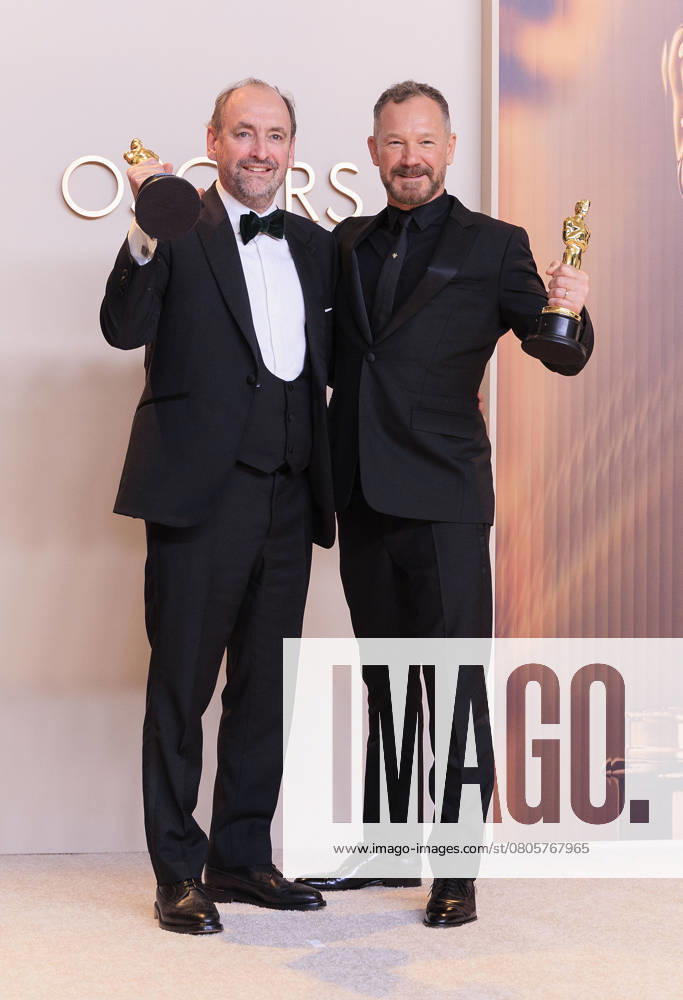 Nathan Crowley (L) and Lee Sandales (R), winners of the Best Production Design award for â€oeWicked†pose in the press room of the 97th Annual Academy Awards on Sunday March 2, 2025 at the Dolby Theater in Hollywood, California. BURT HARRIS BNS PI Hollywood USA - ZUMAp124 20250302_zaa_p124_474