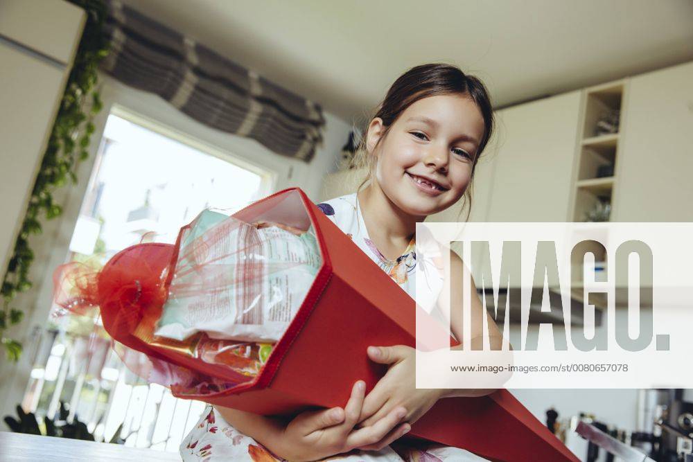 Proud girl holding her school cone model released Symbolfoto property released MFF03705