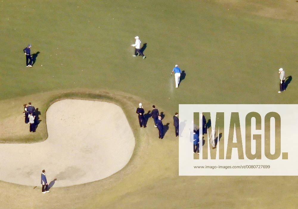 Trump in Japan U.S. President Donald Trump (R) and Japanese Prime Minister Shinzo Abe (L, top) watch professional golfer Hideki Matsuyama (C, blue top) at Kasumigaseki Country Club in Kawagoe, Saitama Prefecture, on Nov. 5, 2017. Photo was taken from a Kyodo News helicopter.