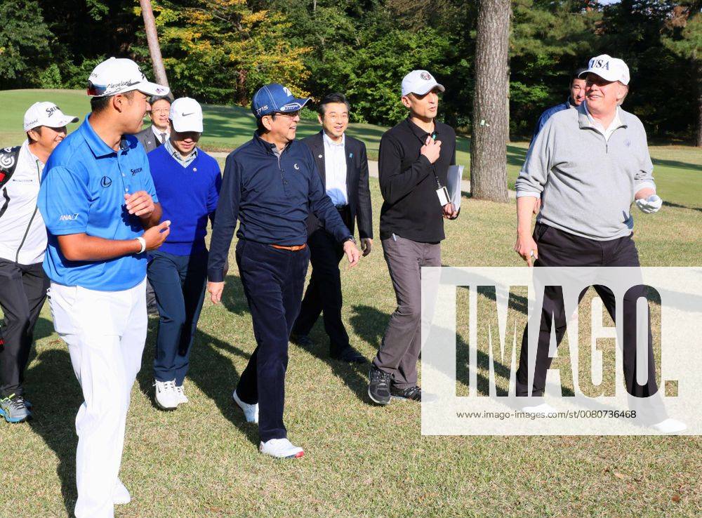 Trump in Japan U.S. President Donald Trump (R), Japanese Prime Minister Shinzo Abe (C, blue hat) and professional golfer Hideki Matsuyama walk at Kasumigaseki Country Club in Kawagoe, Saitama Prefecture, on Nov. 5, 2017. Abe and Trump played the sport a day before their formal talks in Tokyo. (Photo courtesy of the Cabinet Public Relations Office)