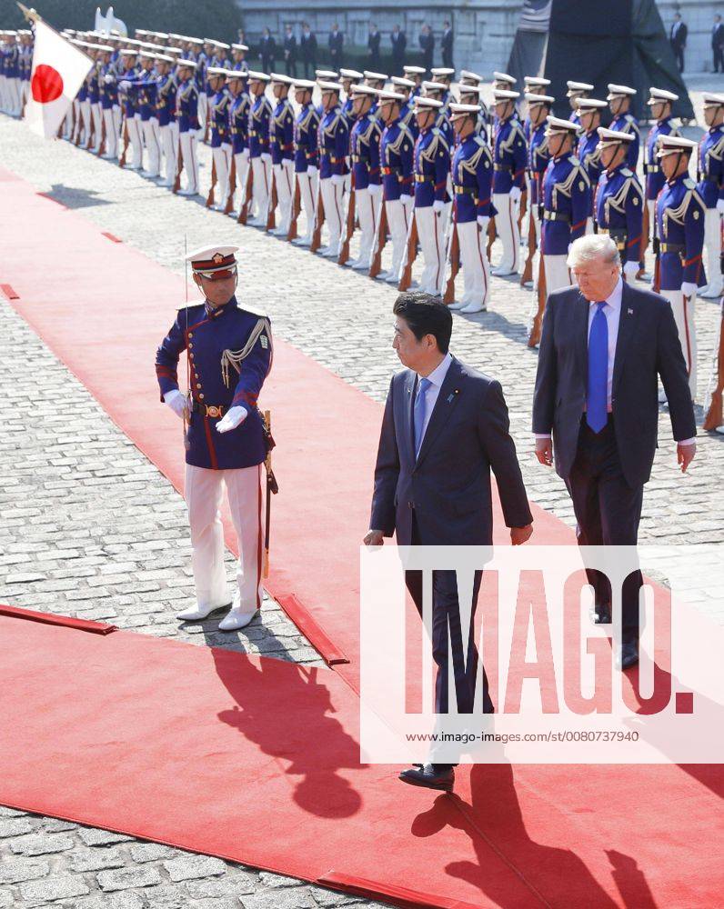 Trump in Japan Japanese Prime Minister Shinzo Abe (C) and U.S. President Donald Trump (R) receive a guard of honor at the State Guest House in Tokyo on Nov. 6, 2017.
