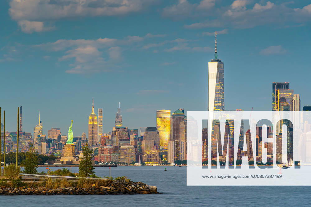 Manhattan s skyline, cityscape of New York City in the United State of America with the Statue of Liberty , 54729064.jpg, statue of liberty, manhattan, new york, nyc, usa, new jersey, metropolitan, new york city, waterfront, american, ny, twilight, metropolis, urban, skyscraper, downtown, sky, architecture, cityscape, skyline, city, travel, york, sunset, new, office, panoramic, exterior, business, view, panorama, america, building, dusk, river, midtown, famous, tower, landmark, sunset, dusk, twilight RECORD DATE NOT STATED
