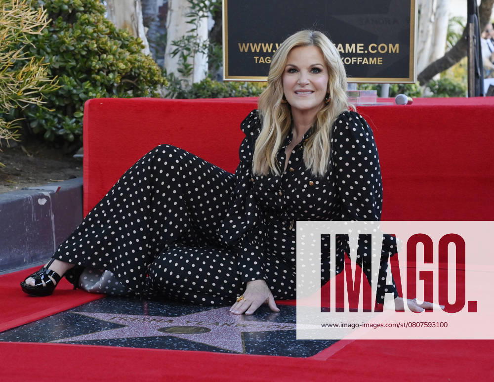 Country music singer Trisha Yearwood sits next to her star during an unveiling ceremony honoring her with the 2,805th star on the Hollywood Walk of Fame in Los Angeles on Monday, March 24, 2025. LAP2025032405 JIMxRUYMEN